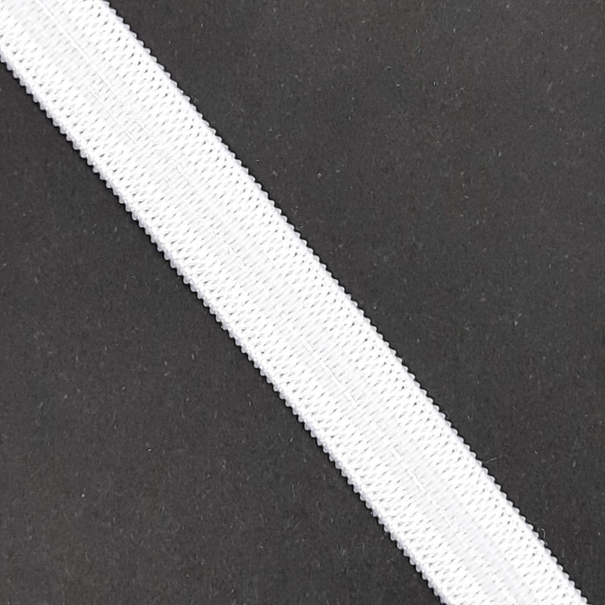 Cinta elástica con silicona de 1 cm. Goma antideslizante blanca.