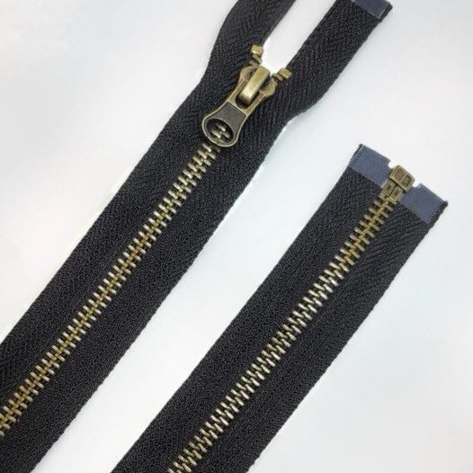 Cremallera separador metálica negro 65cms diente oro viejo.