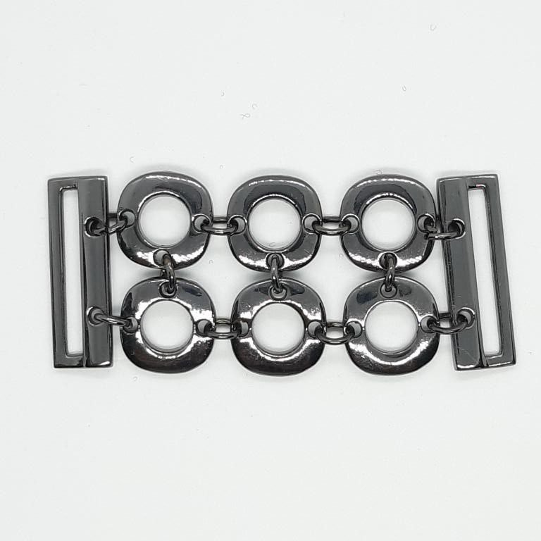 Aplique metálico círculos negro pavonado para cinturón